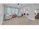 Sunroom with transom windows, French doors and two armchairs at 2125 Oakcrest Ct, Raleigh, NC 27612