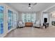 Bright sunroom with French doors, neutral walls, and armchairs at 2125 Oakcrest Ct, Raleigh, NC 27612
