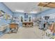 Organized workshop with blue walls, multiple windows, workbench and various tools at 2125 Oakcrest Ct, Raleigh, NC 27612