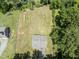 Aerial view of home showcasing its large, well-maintained yard and mature trees at 218 Mason Rd, Durham, NC 27712