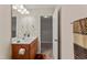 Well-lit bathroom featuring a vanity with good cabinet space, modern fixtures and neutral decor at 218 Mason Rd, Durham, NC 27712