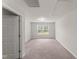 Large bonus room featuring neutral carpet and a window view to the backyard at 218 Mason Rd, Durham, NC 27712