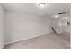 Spacious bonus room featuring neutral carpet, recessed lighting, and view to the backyard at 218 Mason Rd, Durham, NC 27712