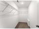 Walk-in closet with shelving, storage space, and carpet at 218 Mason Rd, Durham, NC 27712