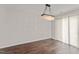 Dining room featuring hardwood floors, a modern chandelier, and sliding door access to outdoor area at 218 Mason Rd, Durham, NC 27712
