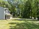 Exterior shot of a home showcasing the siding, garage and lawn at 218 Mason Rd, Durham, NC 27712