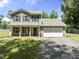 Charming two-story home featuring a welcoming front porch, a two-car garage, and a well-maintained lawn at 218 Mason Rd, Durham, NC 27712