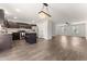 Open-concept living space with wood floors, connecting the kitchen, dining, and living areas at 218 Mason Rd, Durham, NC 27712