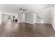 Bright living area with hardwood floors, neutral paint, ceiling fan and access to the backyard at 218 Mason Rd, Durham, NC 27712