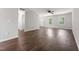 Bright living area offers wood floors, neutral paint, and a ceiling fan, combining style and comfort at 218 Mason Rd, Durham, NC 27712