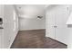 Inviting space featuring neutral walls, wood floors, a ceiling fan, and a closet with bi-fold doors at 218 Mason Rd, Durham, NC 27712