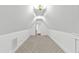 Large attic with carpeted floors and lighting at 2202 St Marys St, Raleigh, NC 27608