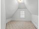 Attic bedroom with carpeted floors at 2202 St Marys St, Raleigh, NC 27608