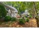 Landscaped backyard of a home featuring a water feature and detached garage at 2202 St Marys St, Raleigh, NC 27608