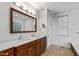 Bathroom with double sink vanity, marble countertop and decorative mirror at 2202 St Marys St, Raleigh, NC 27608