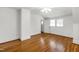 Bedroom with hardwood floors, natural light, and doorway at 2202 St Marys St, Raleigh, NC 27608