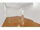 Spacious bedroom with hardwood floors, neutral walls, a ceiling fan, and natural light at 2202 St Marys St, Raleigh, NC 27608