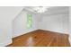 Bright bedroom with hardwood floors, closet, a ceiling fan, and window at 2202 St Marys St, Raleigh, NC 27608
