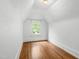 Bright bedroom with hardwood floors and a sunny window at 2202 St Marys St, Raleigh, NC 27608