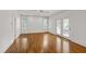 Spacious bedroom features hardwood floors, white walls, and access to the outdoors at 2202 St Marys St, Raleigh, NC 27608