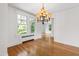Elegant dining room with hardwood floors and sun-filled windows at 2202 St Marys St, Raleigh, NC 27608