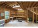 Bright three-car garage interior featuring a workbench, shelves, and ample room for parking and projects at 2202 St Marys St, Raleigh, NC 27608