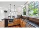 Kitchen featuring an island with marble countertop and stainless steel appliances at 2202 St Marys St, Raleigh, NC 27608