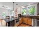 Open kitchen with modern island, stainless steel appliances, and natural lighting at 2202 St Marys St, Raleigh, NC 27608