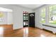 Bright living room with stained glass front door and hardwood floors at 2202 St Marys St, Raleigh, NC 27608
