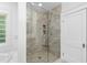 Modern bathroom with frameless glass shower and neutral tile at 2202 St Marys St, Raleigh, NC 27608