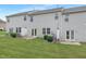 Townhome backyard, grass lawn, and rear exterior of the unit with sliding glass doors at 222 Explorer Dr # 271, Morrisville, NC 27560