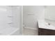 Modern bathroom with tiled floor, shower-tub combo, and sleek vanity with ample lighting at 222 Explorer Dr # 271, Morrisville, NC 27560