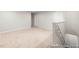Large bonus room with stairs, neutral carpet, and ample space for flexible living at 222 Explorer Dr # 271, Morrisville, NC 27560