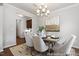 Dining room with a modern chandelier, neutral decor, and an inviting atmosphere at 222 Explorer Dr # 271, Morrisville, NC 27560