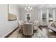 Dining room boasting neutral decor, a modern chandelier, and lots of natural light at 222 Explorer Dr # 271, Morrisville, NC 27560