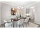 Beautifully staged dining room with decorative chandelier and stylish modern furniture at 222 Explorer Dr # 271, Morrisville, NC 27560