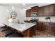 Kitchen showcasing a granite island with seating and modern stainless steel appliances at 222 Explorer Dr # 271, Morrisville, NC 27560