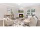 Inviting living room with a fireplace, neutral decor, ample natural light, and hardwood floors throughout at 222 Explorer Dr # 271, Morrisville, NC 27560