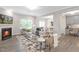 Cozy living room with a fireplace, comfortable seating, natural light, and open access to the dining area and kitchen at 222 Explorer Dr # 271, Morrisville, NC 27560