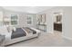 Bright main bedroom featuring neutral decor, two large windows, and an en-suite bath at 222 Explorer Dr # 271, Morrisville, NC 27560