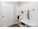 Mudroom area with wainscoting, bench, and hooks; ideal for entryway organization at 222 Explorer Dr # 271, Morrisville, NC 27560