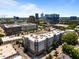 An aerial shot showcasing the city skyline and an apartment building with a rooftop full of HVAC units at 222 Glenwood Ave # 714, Raleigh, NC 27603