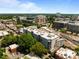 An aerial shot of an apartment building with rooftop units, surrounded by the city on a sunny day at 222 Glenwood Ave # 714, Raleigh, NC 27603