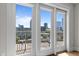 A close-up of a balcony door, with city views visible beyond at 222 Glenwood Ave # 714, Raleigh, NC 27603