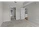 Neutral bedroom with carpet, leading to closet and bathroom at 222 Glenwood Ave # 714, Raleigh, NC 27603