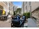 Community outdoor area with comfortable seating, fireplace, and grill at 222 Glenwood Ave # 714, Raleigh, NC 27603