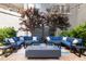 Cozy outdoor lounge space with stylish sectional seating and a modern fire pit at 222 Glenwood Ave # 714, Raleigh, NC 27603