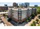 A contemporary apartment building with private balconies boasts a stylish exterior design in an urban setting at 222 Glenwood Ave # 714, Raleigh, NC 27603