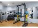 Gym featuring weightlifting rack, dumbbells, and mirrors for a complete workout experience at 222 Glenwood Ave # 714, Raleigh, NC 27603