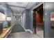 Contemporary hallway with sleek elevator and stylish decor, offering a welcoming ambiance for residents and visitors at 222 Glenwood Ave # 714, Raleigh, NC 27603